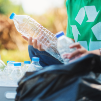 Person sorting plastics for recycling