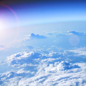 Satellite view of Earth from space showing cloud formations over the ocean, illustrating the impact of atmospheric changes on global warming