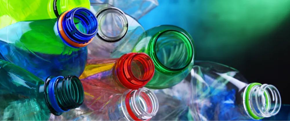 Close-up of colourful empty plastic drinks bottles, representing packaging waste and its role in carbon reporting under SECR